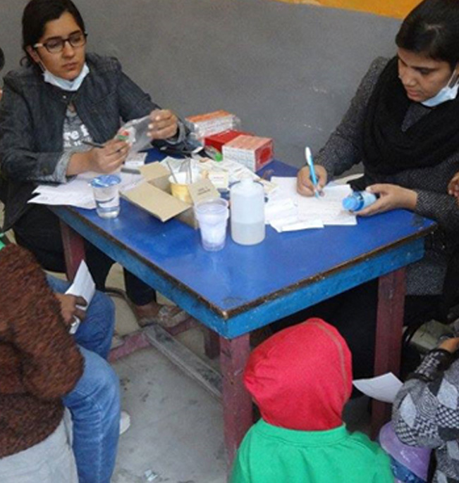 ACCORD staff supporting patients and families at a community outreach clinic